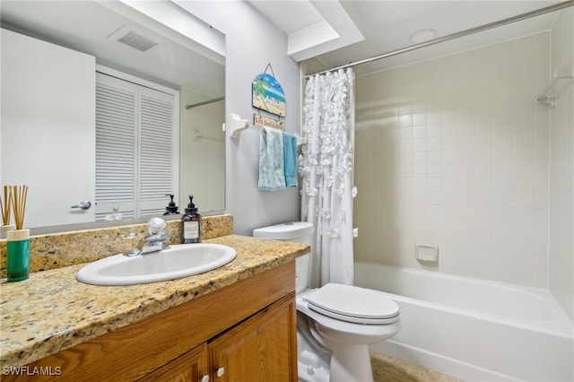 full bathroom featuring vanity, toilet, and shower / tub combo with curtain