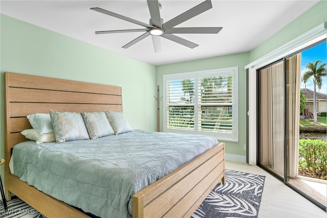 bedroom featuring access to outside, ceiling fan, and light hardwood / wood-style floors