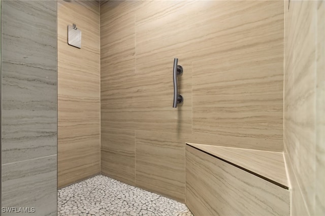 bathroom with tiled shower