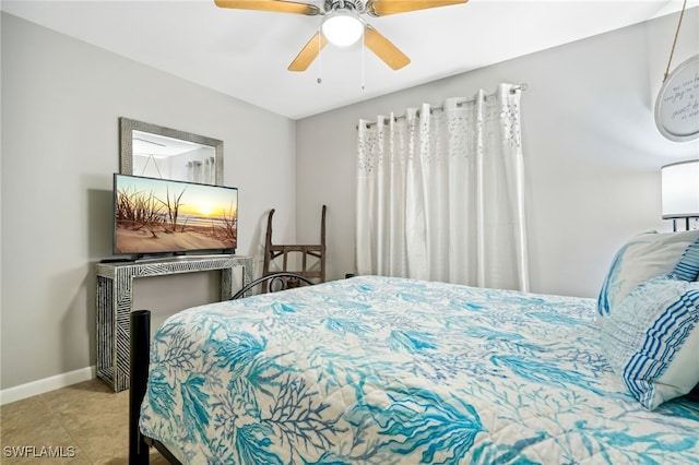 tiled bedroom with ceiling fan