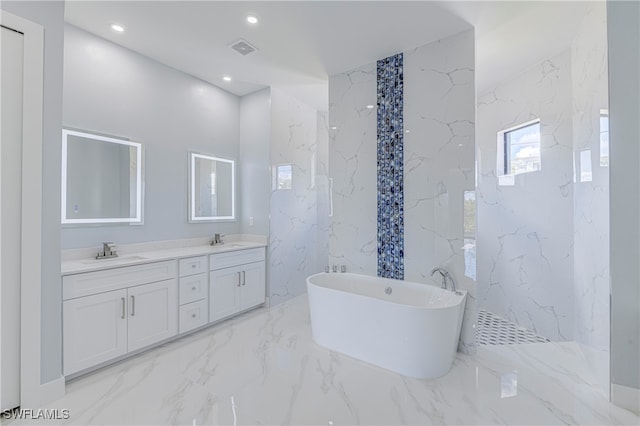 bathroom with a bathing tub and vanity