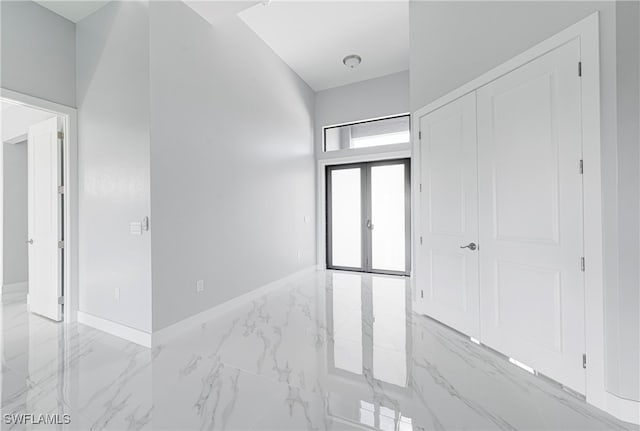 foyer entrance featuring french doors