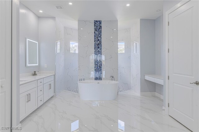 bathroom with vanity and a bathtub