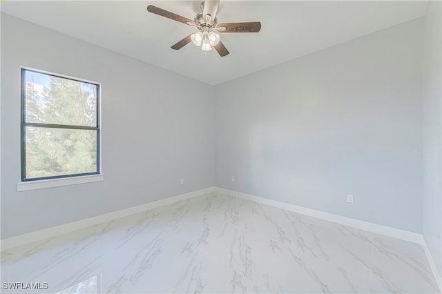 spare room with ceiling fan