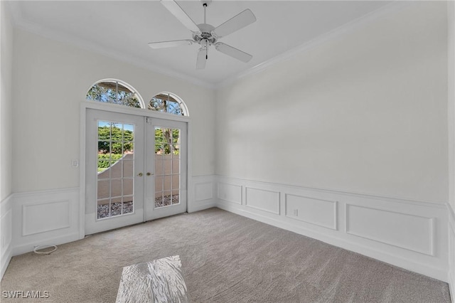 11752 Longshore Way W, Naples, FL 34119 - carpeted empty room with ornamental molding, french doors, wainscoting, a decorative wall, and ceiling fan