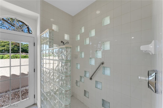 bathroom with a tile shower