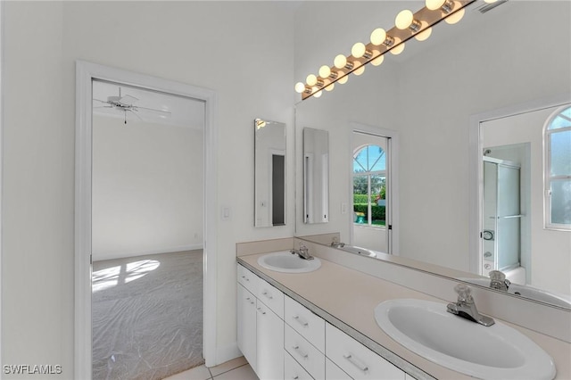 11752 Longshore Way W, Naples, FL 34119 - bathroom featuring double vanity, an enclosed shower, and tile patterned floors