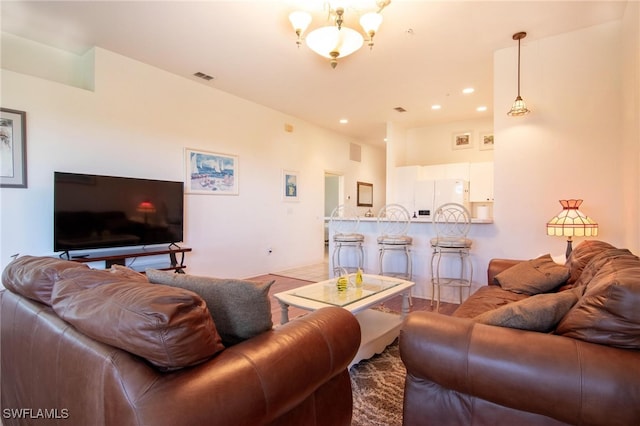 living room with an inviting chandelier