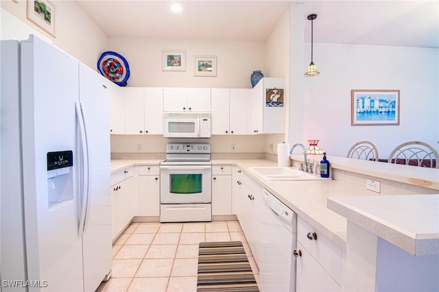 kitchen with kitchen peninsula, hanging light fixtures, sink, white cabinetry, and white appliances