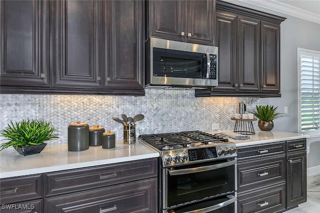 kitchen featuring stainless steel appliances, tasteful backsplash, and crown molding