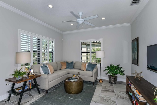 living room with ornamental molding and ceiling fan