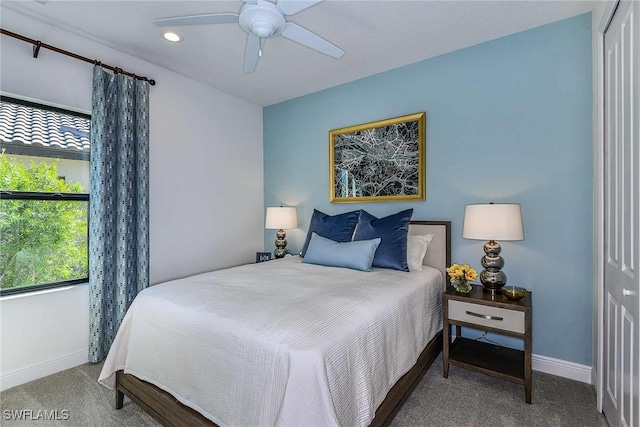 carpeted bedroom with a closet and ceiling fan