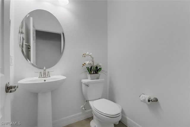 bathroom with sink and toilet