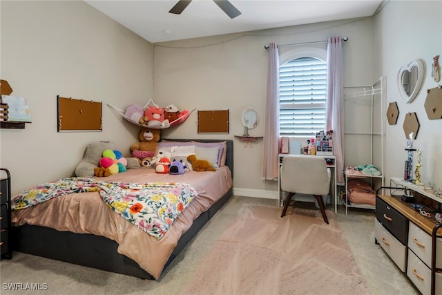 bedroom featuring light colored carpet and ceiling fan