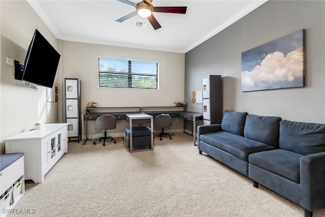 carpeted home office featuring ceiling fan and crown molding