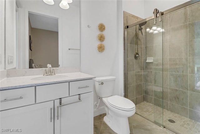 bathroom with walk in shower, tile patterned flooring, vanity, and toilet