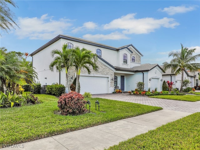 view of front of property with a garage and a front yard