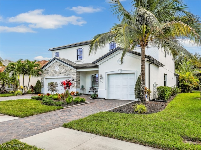 mediterranean / spanish-style home with a front yard