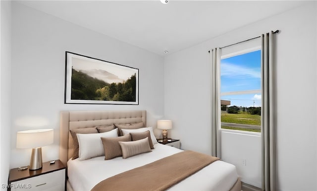 bedroom featuring multiple windows