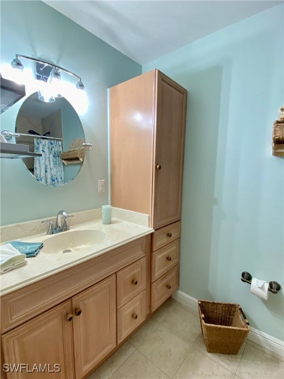 bathroom featuring tile patterned flooring and vanity