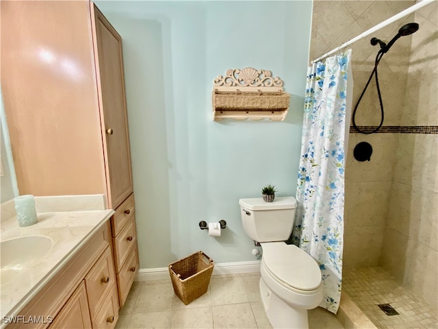 bathroom featuring toilet, a shower with curtain, vanity, and tile patterned flooring