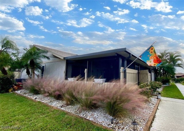 view of home's exterior featuring a yard