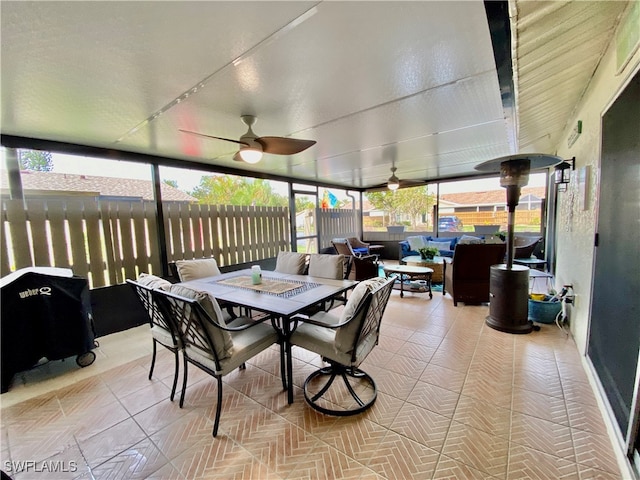 sunroom / solarium with ceiling fan