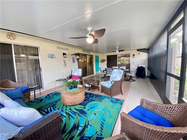 sunroom with ceiling fan and a healthy amount of sunlight