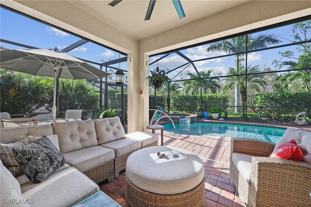 view of swimming pool with outdoor lounge area, a lanai, a patio, and pool water feature