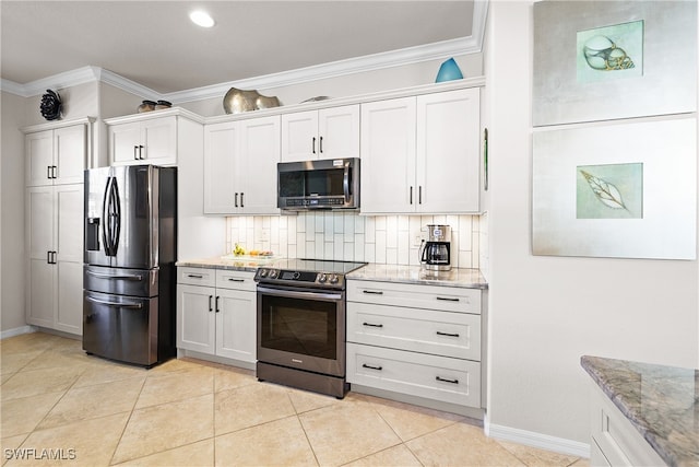 kitchen with white cabinets, appliances with stainless steel finishes, decorative backsplash, and crown molding