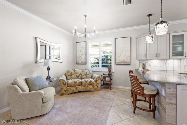 tiled living room with a chandelier and ornamental molding