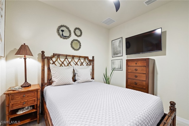 bedroom featuring ceiling fan and wood-type flooring