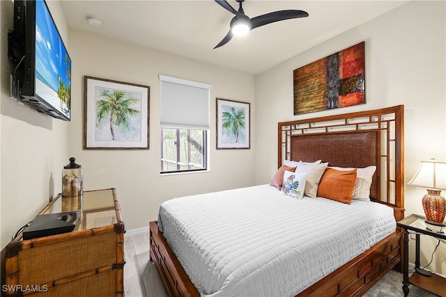 bedroom with ceiling fan and wood-type flooring