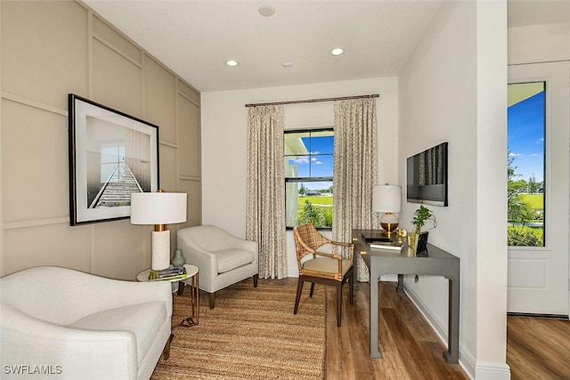 living area with hardwood / wood-style flooring