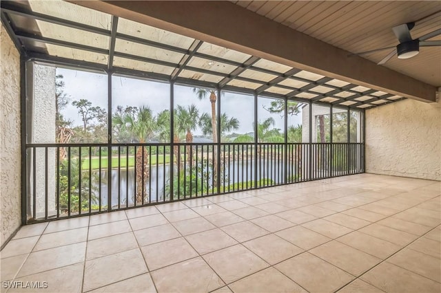 16448 Timberlakes Dr Unit 202, Fort Myers, FL 33908 - unfurnished sunroom featuring a water view, ceiling fan, and beam ceiling