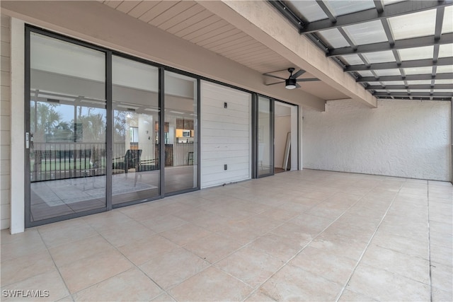 view of patio featuring ceiling fan