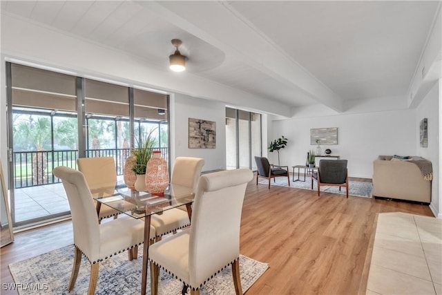 16448 Timberlakes Dr Unit 202, Fort Myers, FL 33908 - dining room with light wood finished floors and beamed ceiling