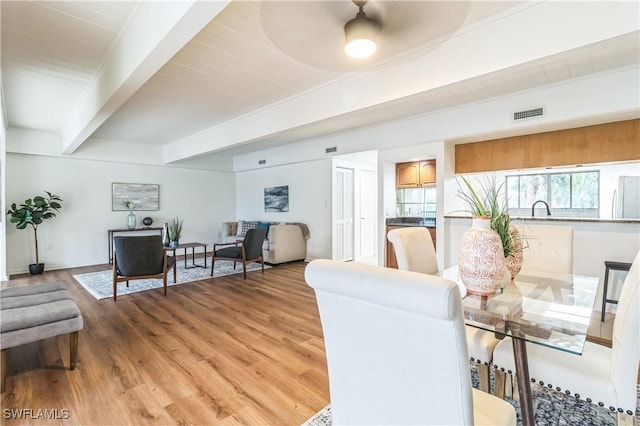 16448 Timberlakes Dr Unit 202, Fort Myers, FL 33908 - dining space with beam ceiling and light wood-style flooring