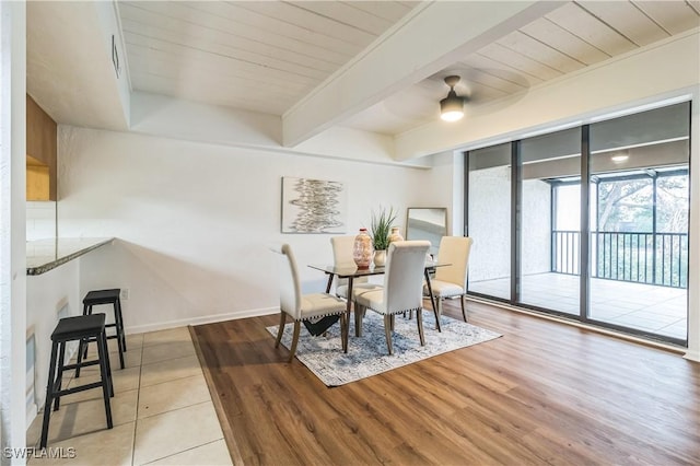 16448 Timberlakes Dr Unit 202, Fort Myers, FL 33908 - dining space with wood finished floors, wooden ceiling with exposed beams, baseboards, and a ceiling fan
