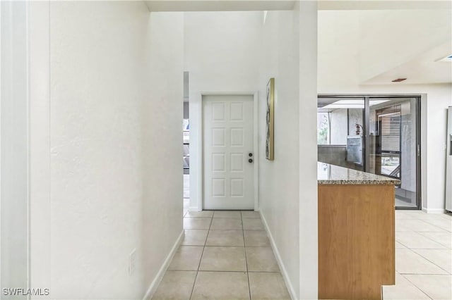 16448 Timberlakes Dr Unit 202, Fort Myers, FL 33908 - hall featuring light tile patterned floors and baseboards