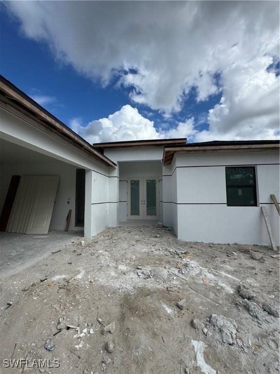 view of side of home featuring french doors