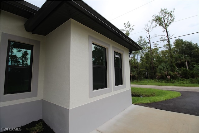 view of property exterior with a patio