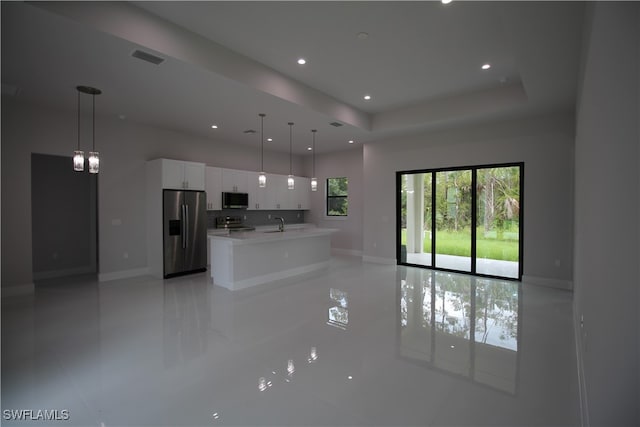 unfurnished living room featuring sink