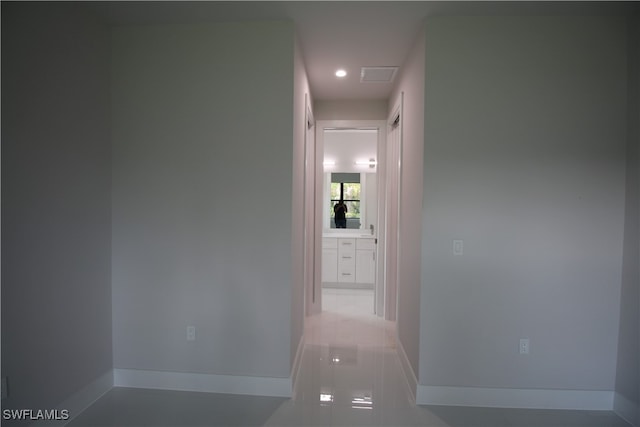 corridor featuring tile patterned flooring