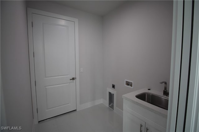 laundry area featuring hookup for an electric dryer, cabinets, sink, light tile patterned floors, and washer hookup