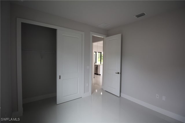 unfurnished bedroom featuring a closet