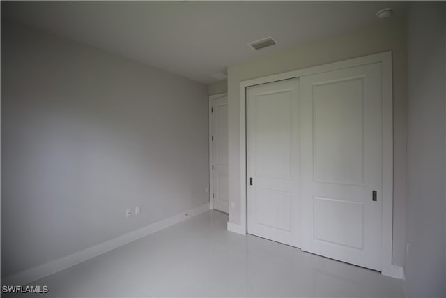 unfurnished bedroom with a closet