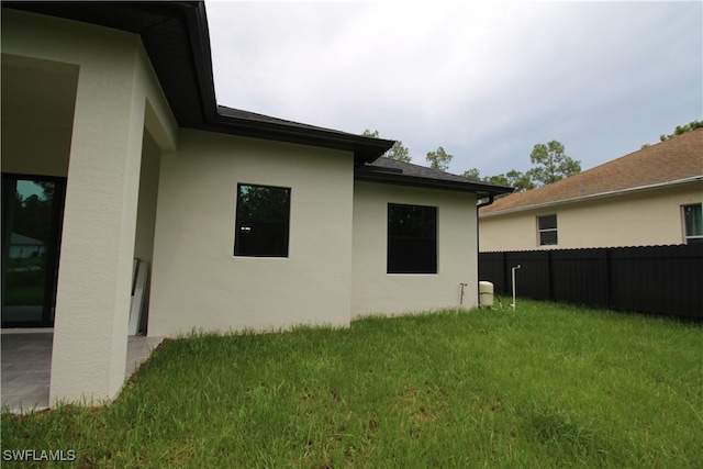 view of home's exterior featuring a lawn