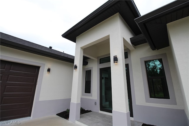 entrance to property featuring a garage