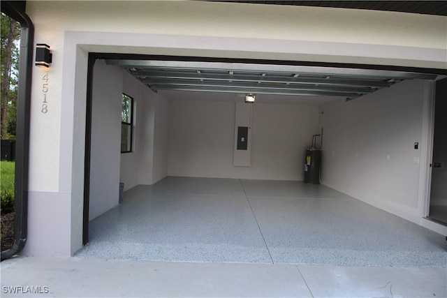 garage with electric water heater and a carport